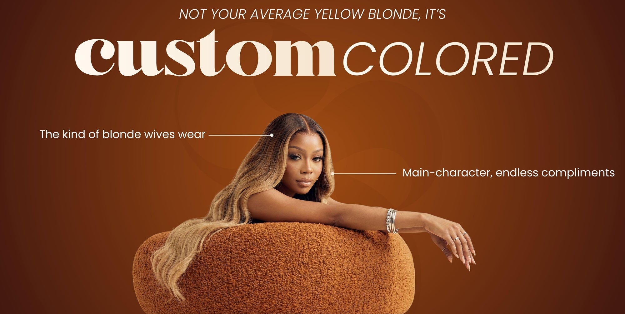 black Woman with blonde hair dark roots sitting on a brown chair against a brown background with text about 'custom colored' hair.